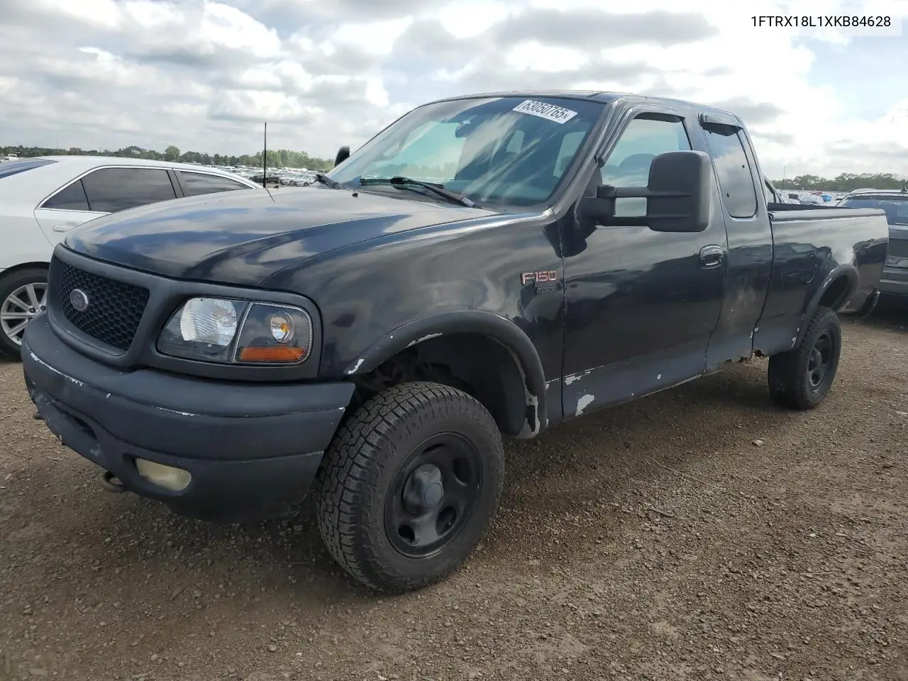 1999 Ford F150 VIN: 1FTRX18L1XKB84628 Lot: 63050765