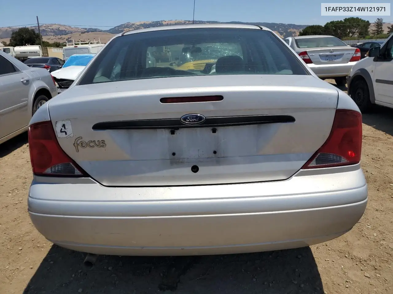 2004 Ford Focus Lx VIN: 1FAFP33Z14W121971 Lot: 63090405