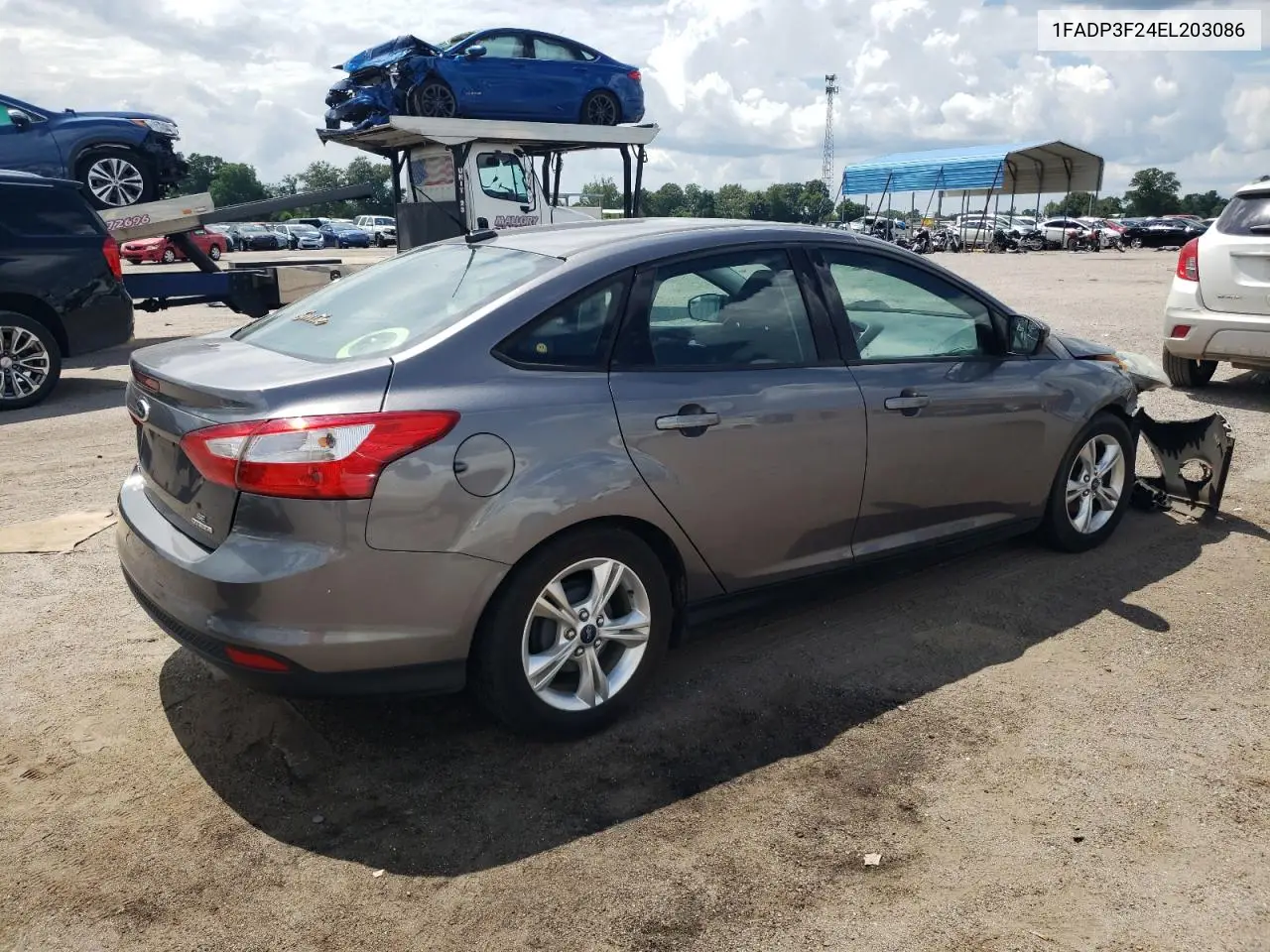 2014 Ford Focus Se VIN: 1FADP3F24EL203086 Lot: 62996615