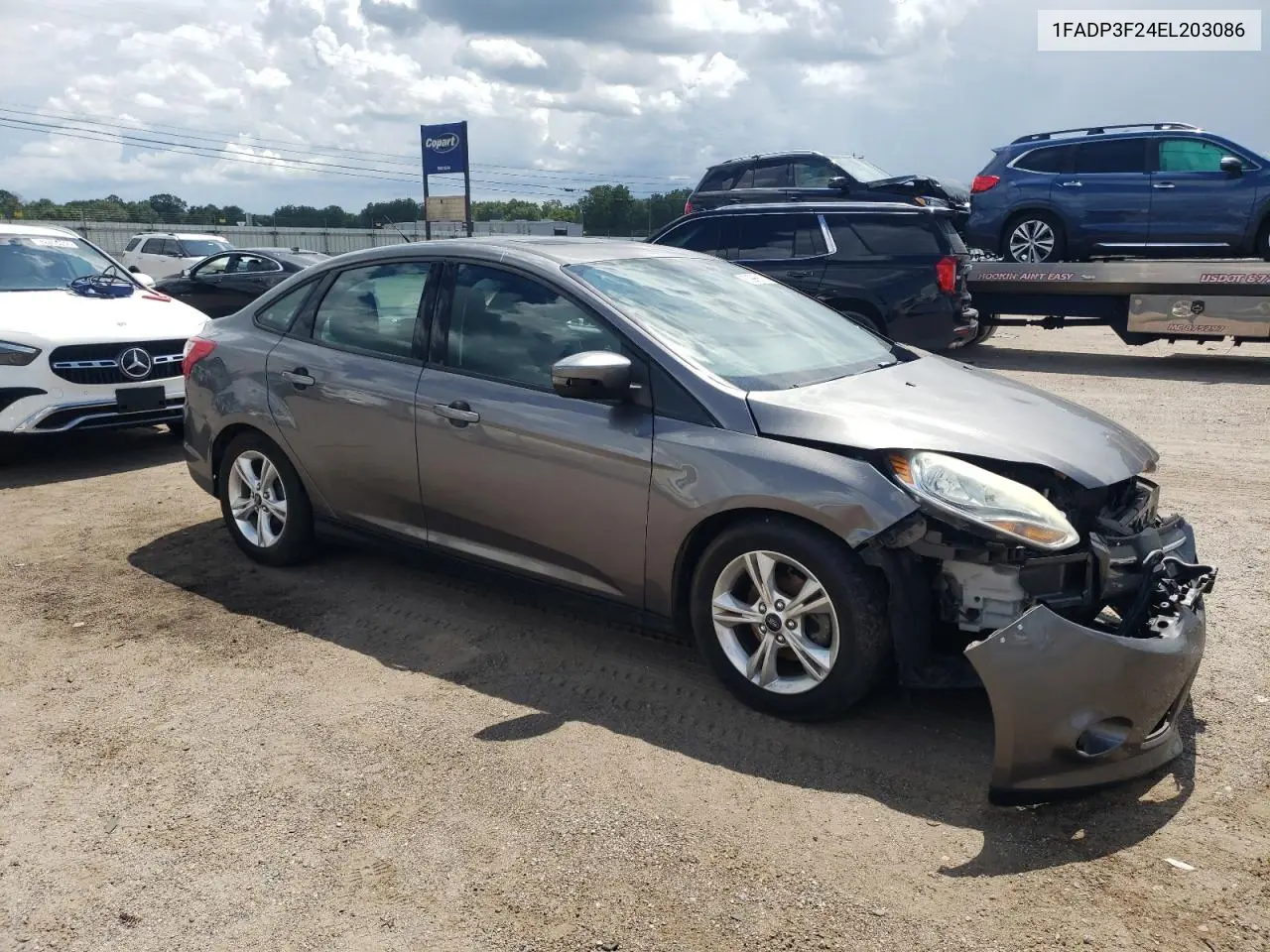 2014 Ford Focus Se VIN: 1FADP3F24EL203086 Lot: 62996615