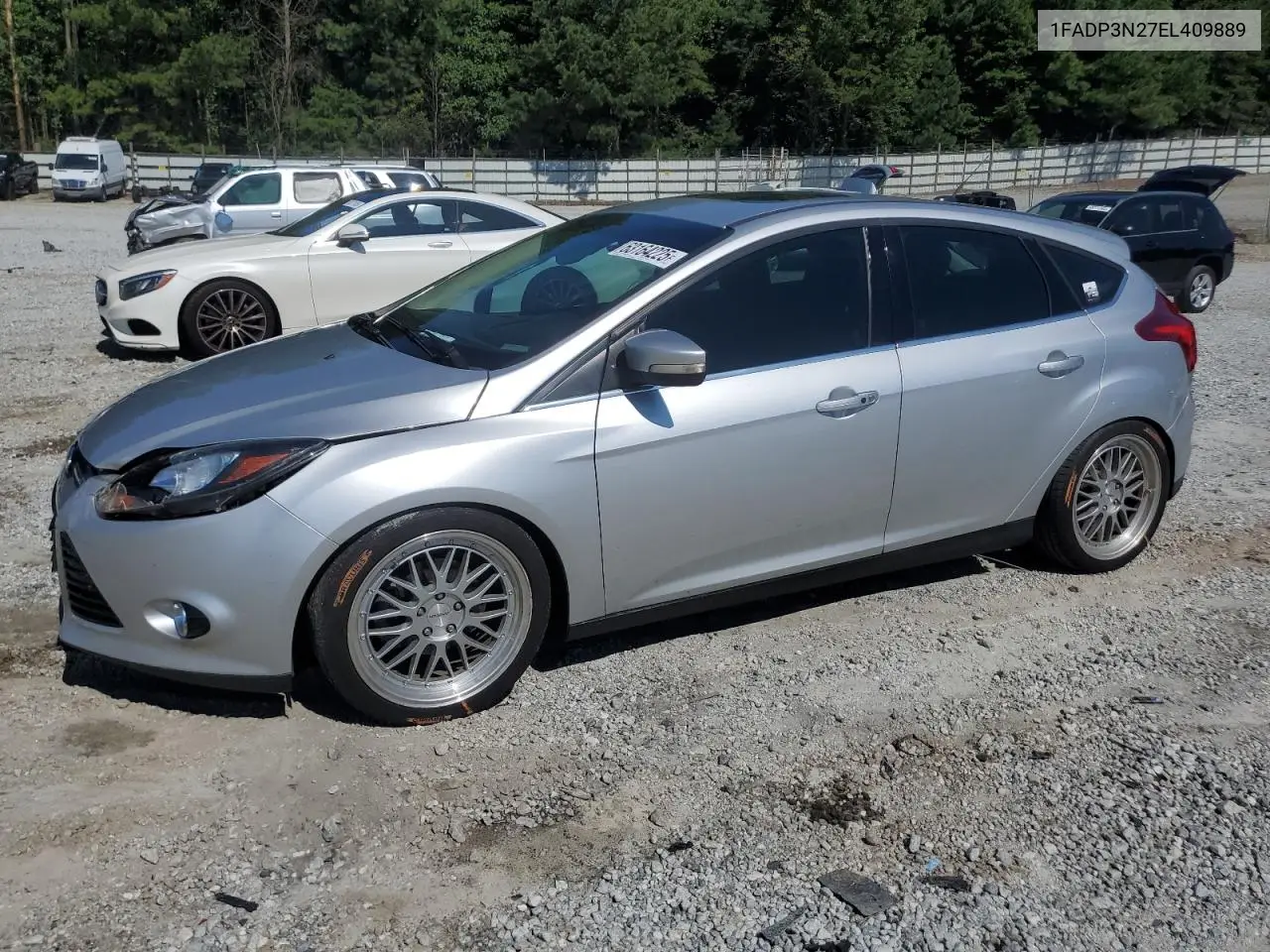 2014 Ford Focus Titanium VIN: 1FADP3N27EL409889 Lot: 63164225