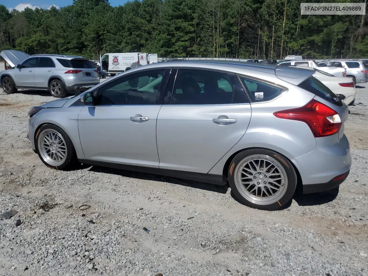 2014 Ford Focus Titanium VIN: 1FADP3N27EL409889 Lot: 63164225