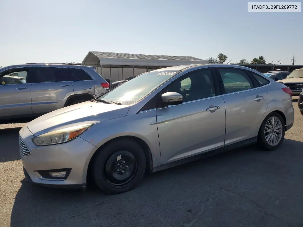 2015 Ford Focus Titanium VIN: 1FADP3J29FL269772 Lot: 63290225