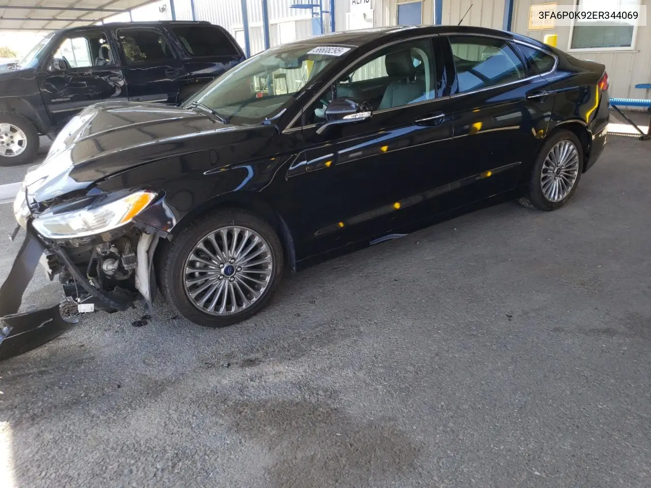 2014 Ford Fusion Titanium VIN: 3FA6P0K92ER344069 Lot: 56608295