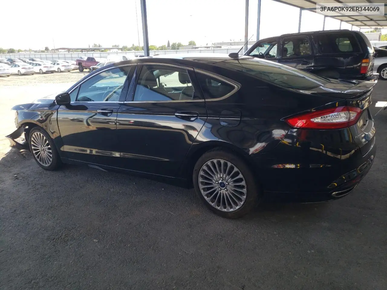 2014 Ford Fusion Titanium VIN: 3FA6P0K92ER344069 Lot: 56608295