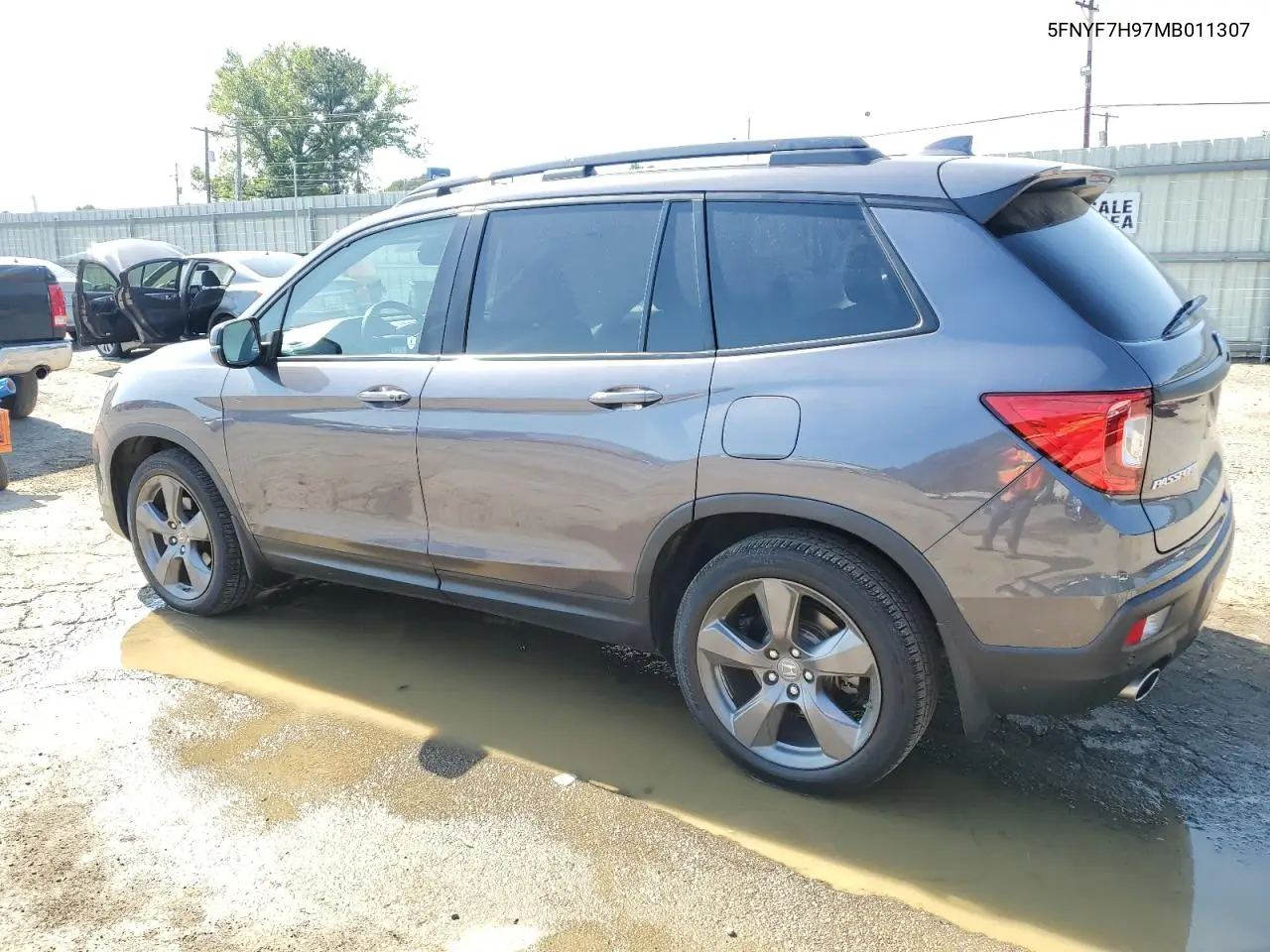 2021 Honda Passport Touring VIN: 5FNYF7H97MB011307 Lot: 52310415