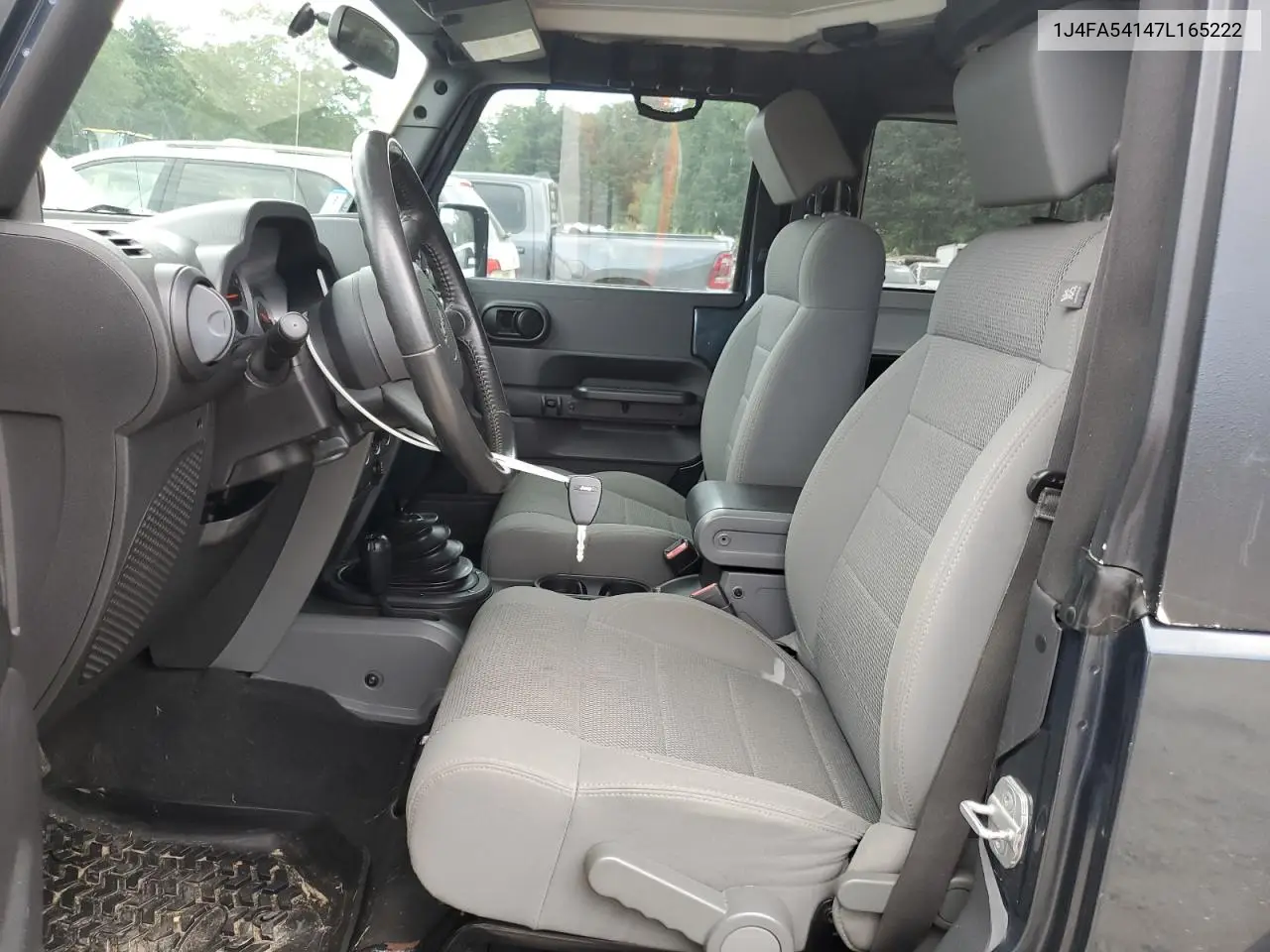 2007 Jeep Wrangler Sahara VIN: 1J4FA54147L165222 Lot: 62819495