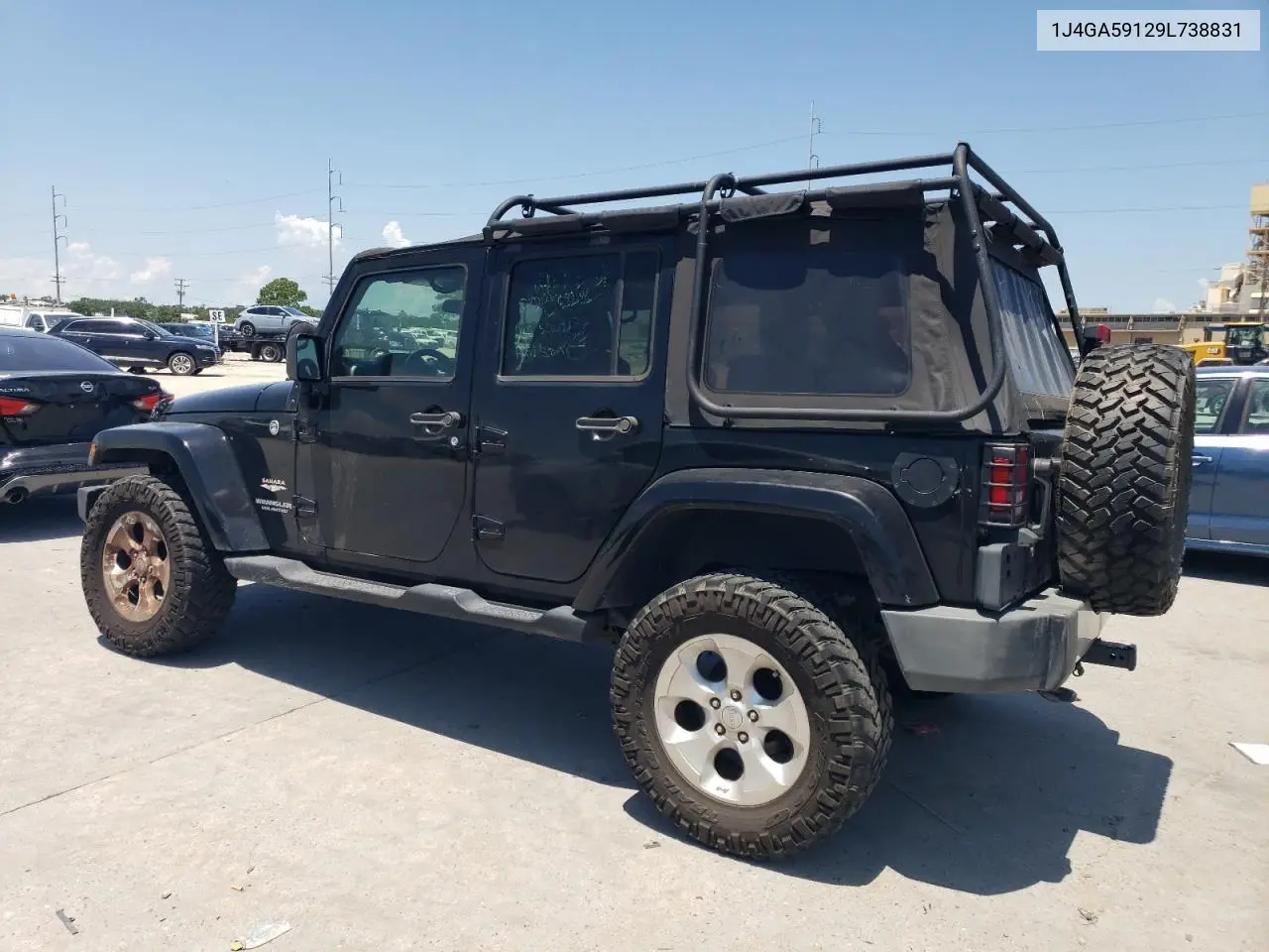 2009 Jeep Wrangler Unlimited Sahara VIN: 1J4GA59129L738831 Lot: 65683625