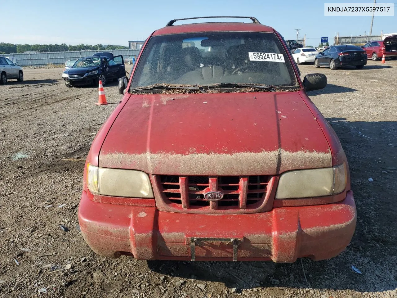 1999 Kia Sportage VIN: KNDJA7237X5597517 Lot: 82673504