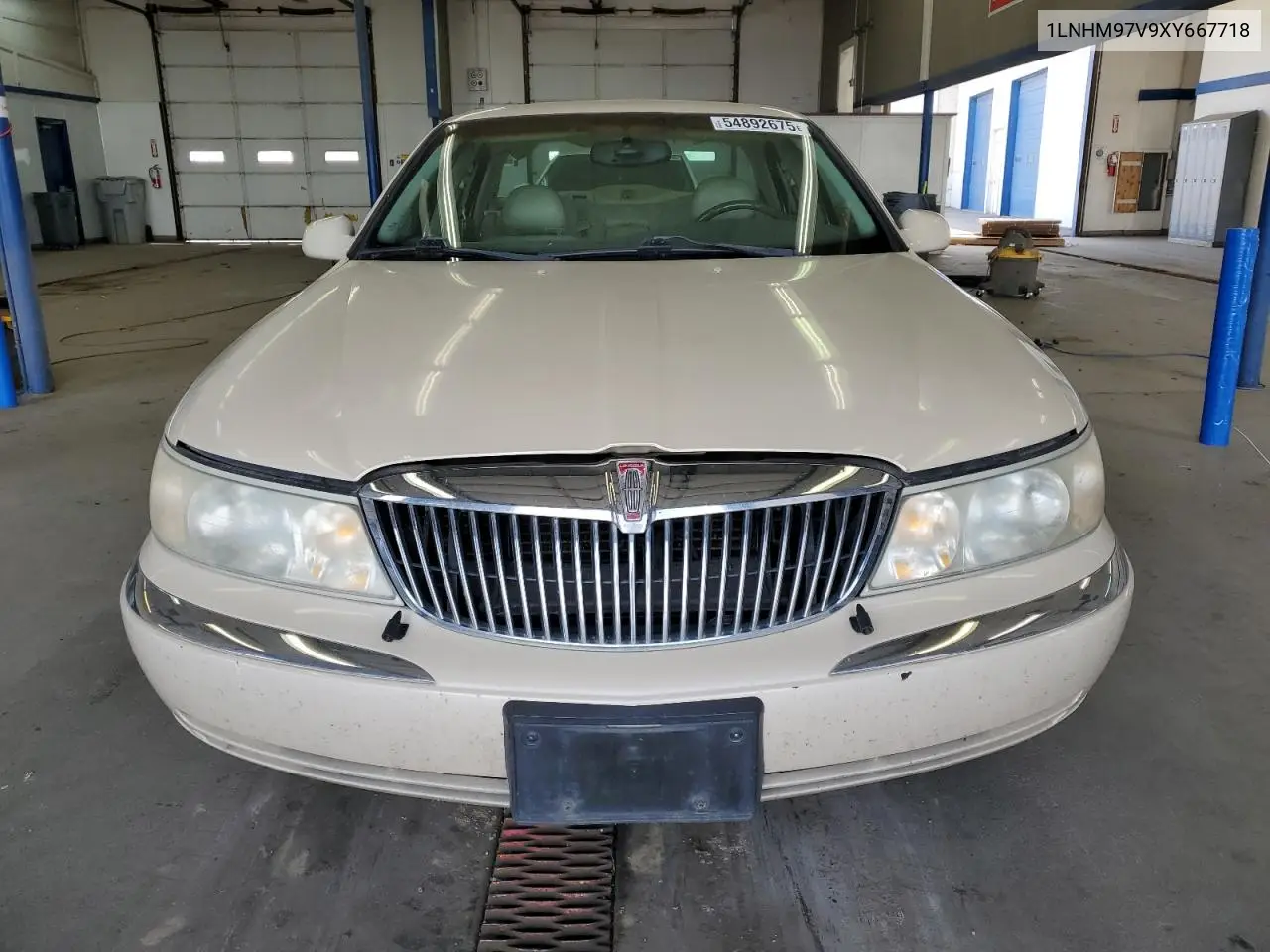 1999 Lincoln Continental VIN: 1LNHM97V9XY667718 Lot: 54892675