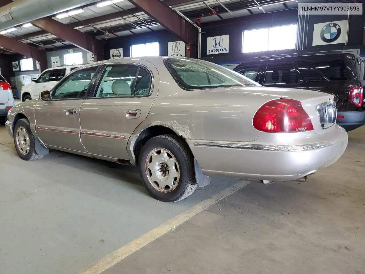 2000 Lincoln Continental VIN: 1LNHM97V1YY909595 Lot: 63145915