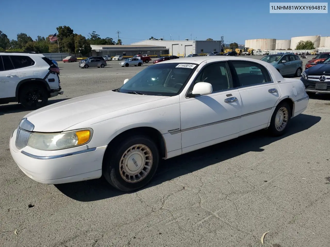 1999 Lincoln Town Car Executive VIN: 1LNHM81WXXY694812 Lot: 61448815