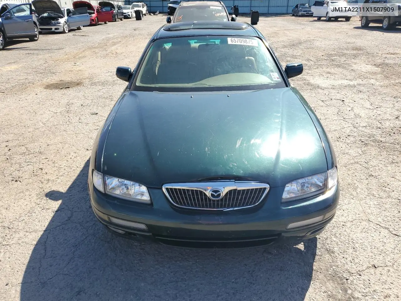 1999 Mazda Millenia VIN: JM1TA2211X1507909 Lot: 65709875
