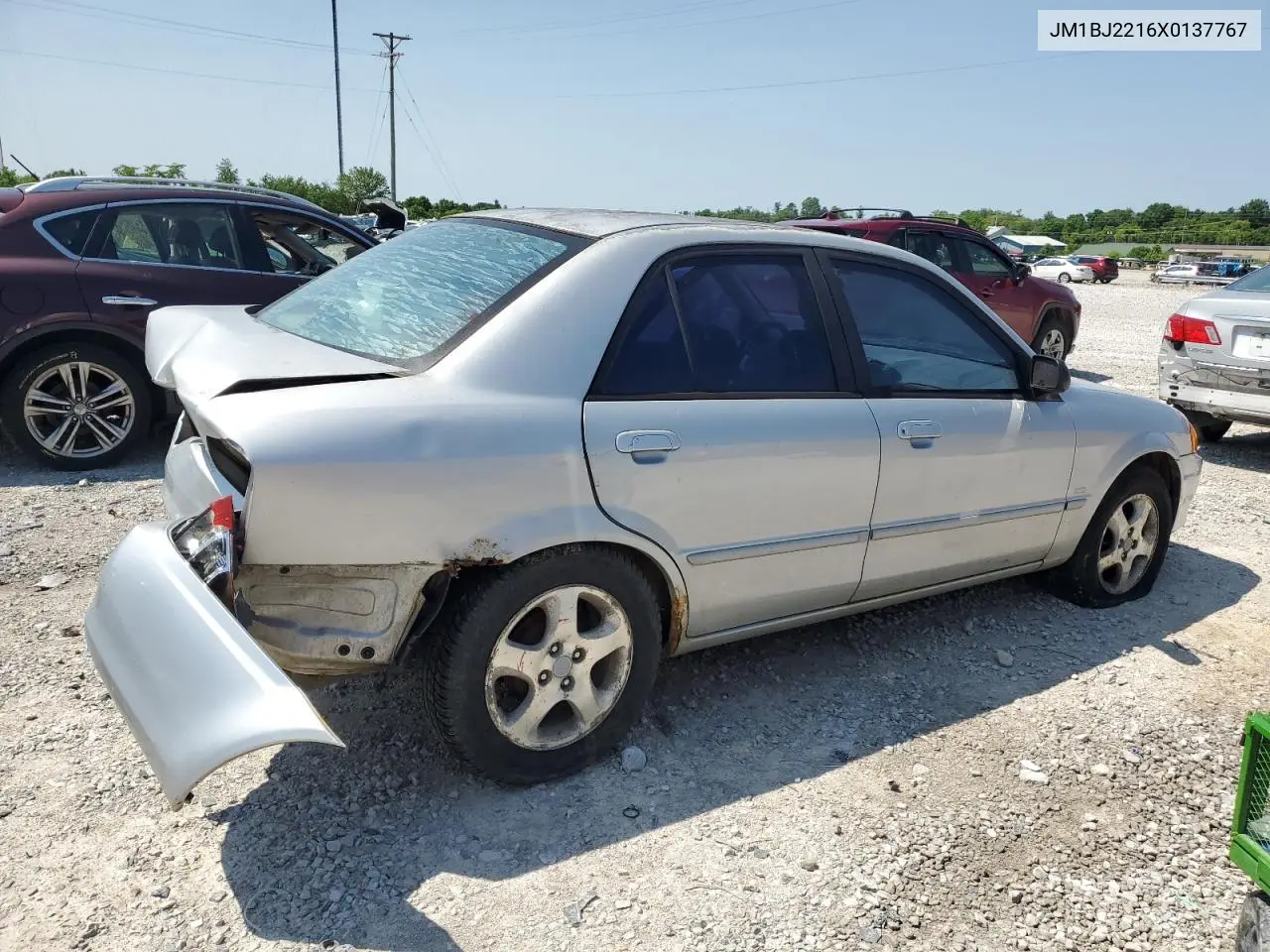 1999 Mazda Protege Es VIN: JM1BJ2216X0137767 Lot: 59116315