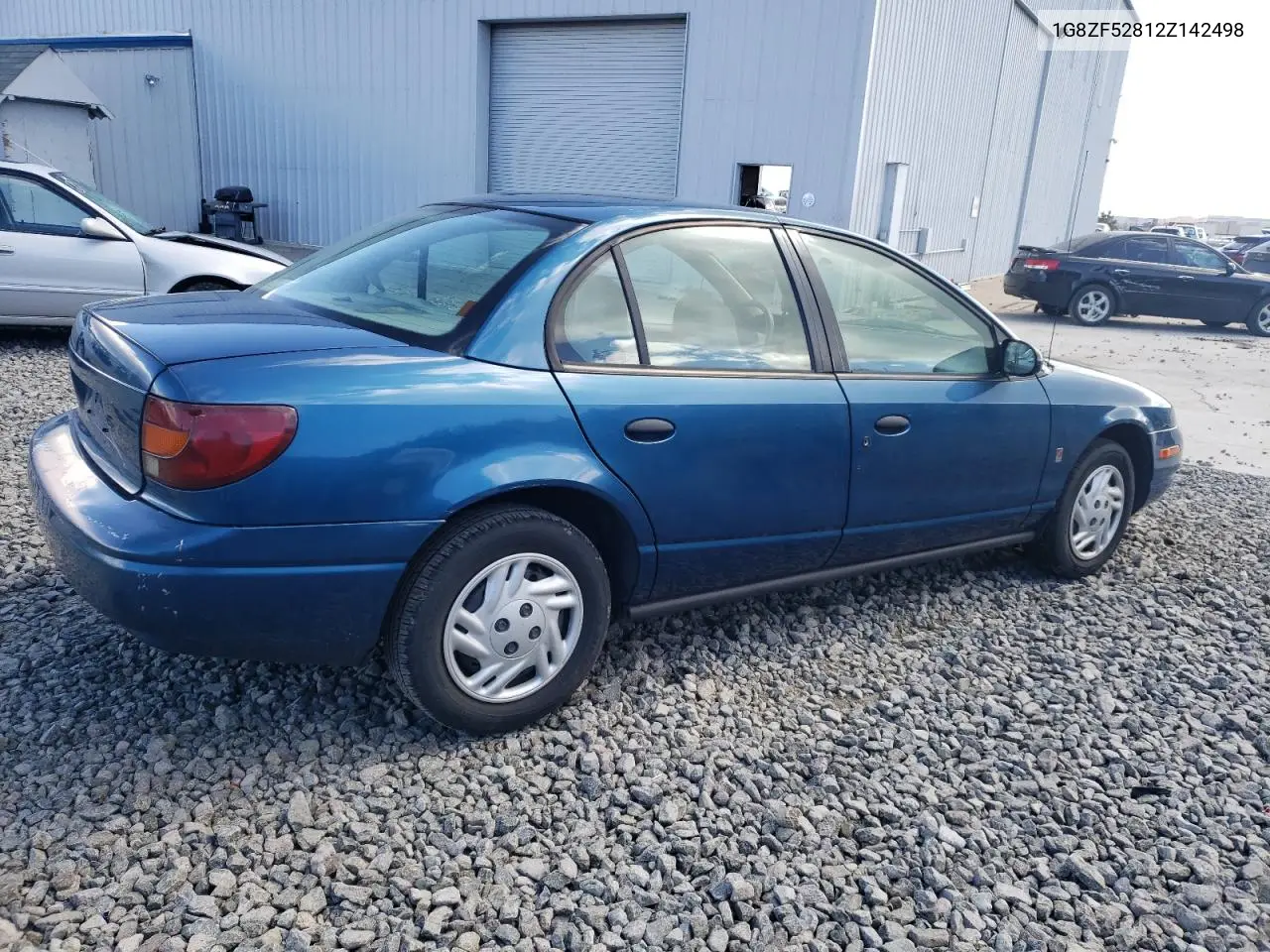 2002 Saturn Sl VIN: 1G8ZF52812Z142498 Lot: 48753605