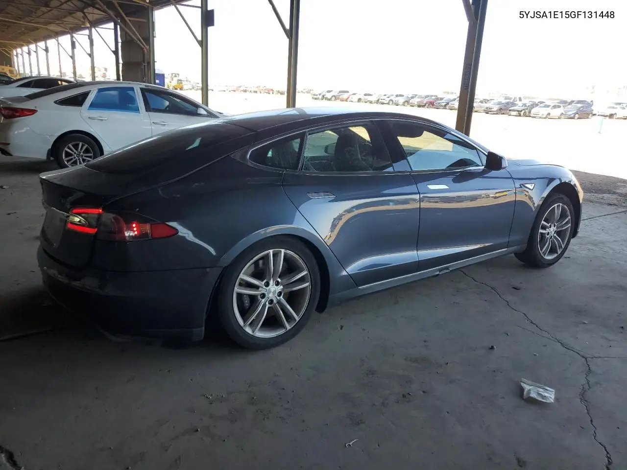2016 Tesla Model S VIN: 5YJSA1E15GF131448 Lot: 57100245