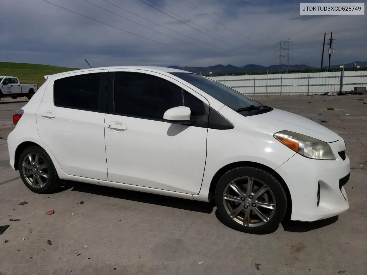 2012 Toyota Yaris VIN: JTDKTUD3XCD528749 Lot: 56803205