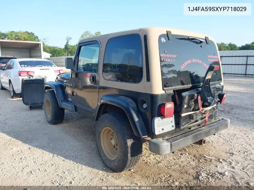 2000 Jeep Wrangler Sahara VIN: 1J4FA59SXYP718029 Lot: 42583372