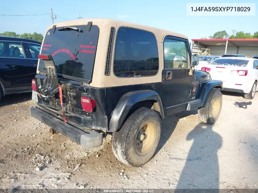 2000 Jeep Wrangler Sahara VIN: 1J4FA59SXYP718029 Lot: 42583372