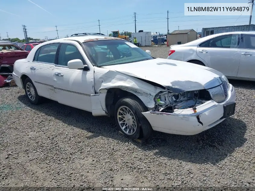 2001 Lincoln Continental VIN: 1LN8M82W11Y694879 Lot: 42313003