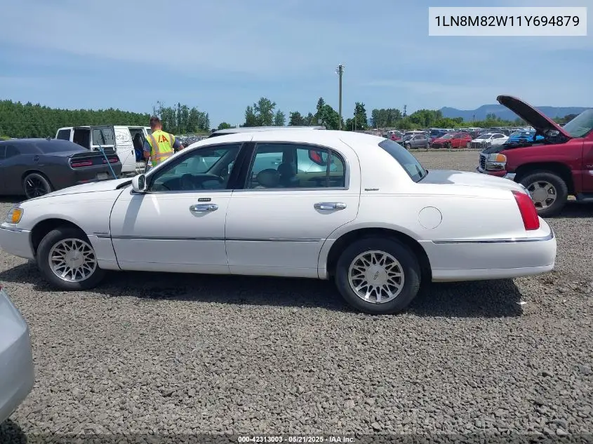 2001 Lincoln Continental VIN: 1LN8M82W11Y694879 Lot: 42313003