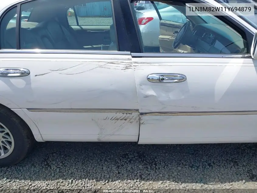 2001 Lincoln Continental VIN: 1LN8M82W11Y694879 Lot: 42313003