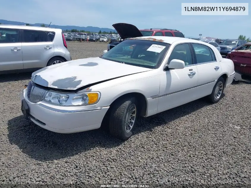 2001 Lincoln Continental VIN: 1LN8M82W11Y694879 Lot: 42313003